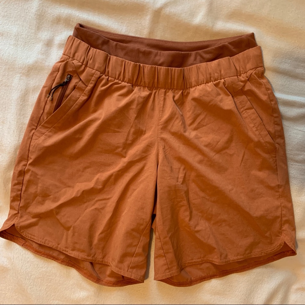 REI long orange athletic shorts